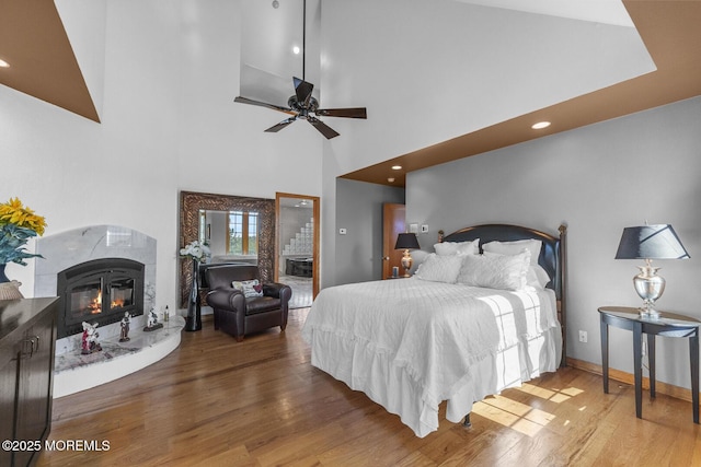 18 Schoolhouse Rd, Cream Ridge, NJ 08514 - bedroom featuring wood finished floors, high vaulted ceiling, baseboards, recessed lighting, and a premium fireplace