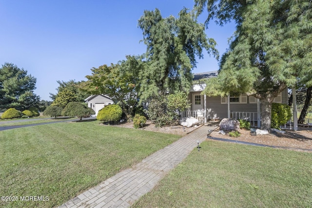 18 Schoolhouse Rd, Cream Ridge, NJ 08514 - view of front of home featuring covered porch and a front yard