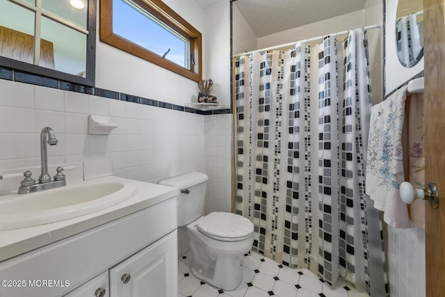 18 Schoolhouse Rd, Cream Ridge, NJ 08514 - full bath featuring vanity, a shower with shower curtain, toilet, and tile walls
