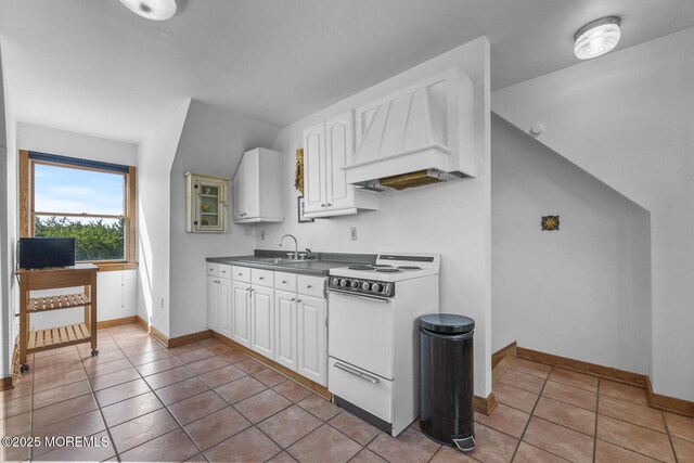 18 Schoolhouse Rd, Cream Ridge, NJ 08514 - kitchen with electric stove, a sink, light tile patterned floors, and white cabinets