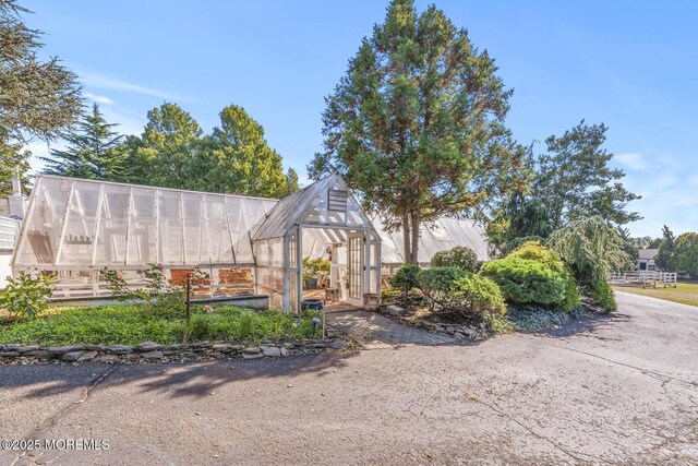 18 Schoolhouse Rd, Cream Ridge, NJ 08514 - exterior space featuring a greenhouse and an outbuilding