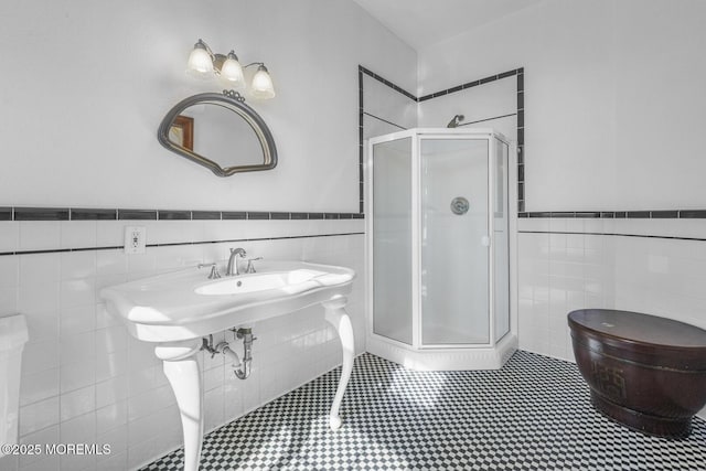 18 Schoolhouse Rd, Cream Ridge, NJ 08514 - full bathroom featuring tile walls, a shower stall, and a wainscoted wall