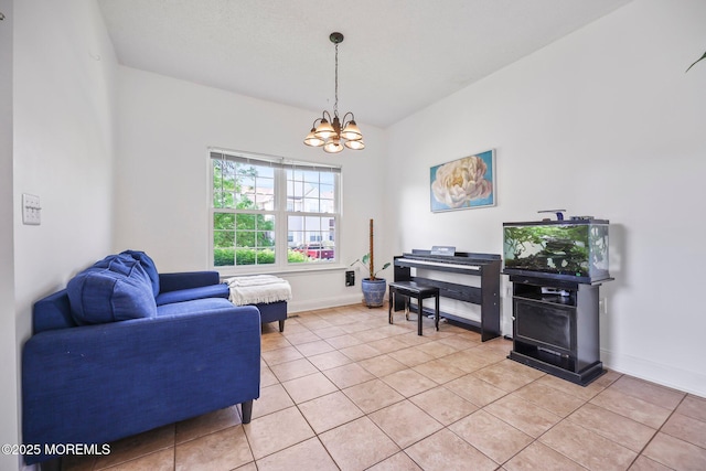 604 Gaitway Ct, Freehold, NJ 07728 - living area featuring baseboards, light tile patterned flooring, and a notable chandelier