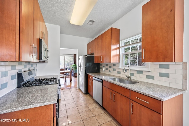 604 Gaitway Ct, Freehold, NJ 07728 - kitchen with a sink, a healthy amount of sunlight, stainless steel appliances, and visible vents