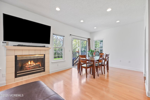 604 Gaitway Ct, Freehold, NJ 07728 - dining area featuring light wood-style floors, baseboards, recessed lighting, and a textured ceiling