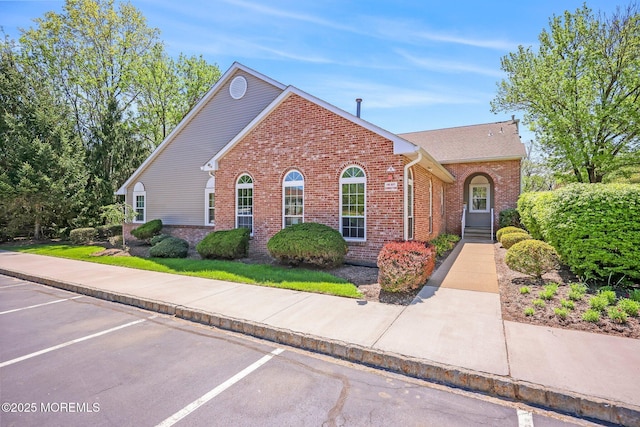 604 Gaitway Ct, Freehold, NJ 07728 - view of front of house featuring uncovered parking and brick siding
