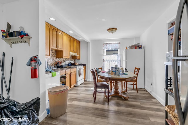 24 Monmouth Ave, Freehold, NJ 07728 - dining space featuring baseboards, recessed lighting, and light wood-style flooring