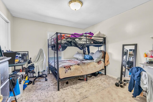 24 Monmouth Ave, Freehold, NJ 07728 - carpeted bedroom with a closet and baseboards