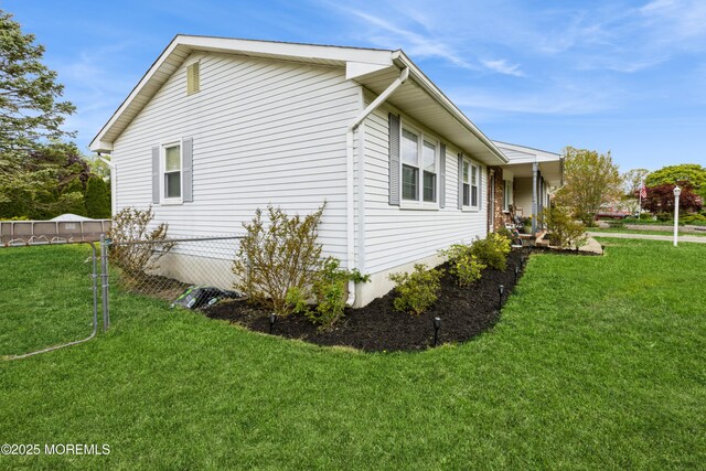 303 Savannah Rd, Toms River, NJ 08757 - view of home's exterior with fence and a yard