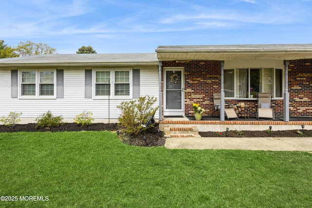 303 Savannah Rd, Toms River, NJ 08757 - ranch-style home featuring covered porch, brick siding, and a front yard