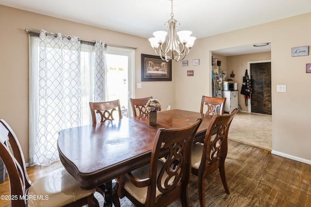 303 Savannah Rd, Toms River, NJ 08757 - dining area with an inviting chandelier, baseboards, and wood finished floors