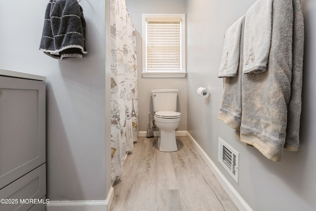 303 Savannah Rd, Toms River, NJ 08757 - full bathroom featuring toilet, a shower with shower curtain, baseboards, wood finished floors, and visible vents