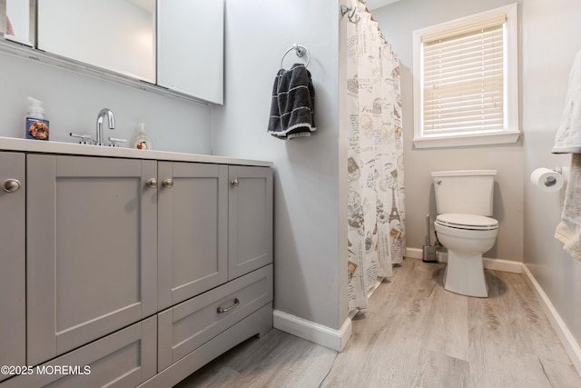 303 Savannah Rd, Toms River, NJ 08757 - bathroom with toilet, baseboards, wood finished floors, and vanity