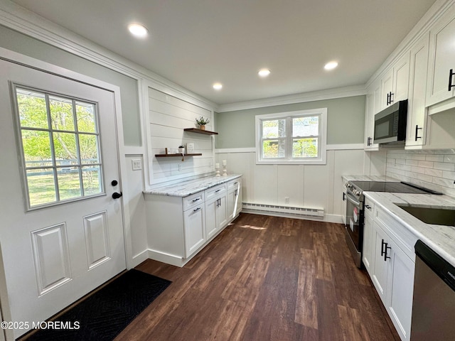 kitchen featuring open shelves, light stone counters, stainless steel appliances, a baseboard heating unit, and dark wood-style floors
