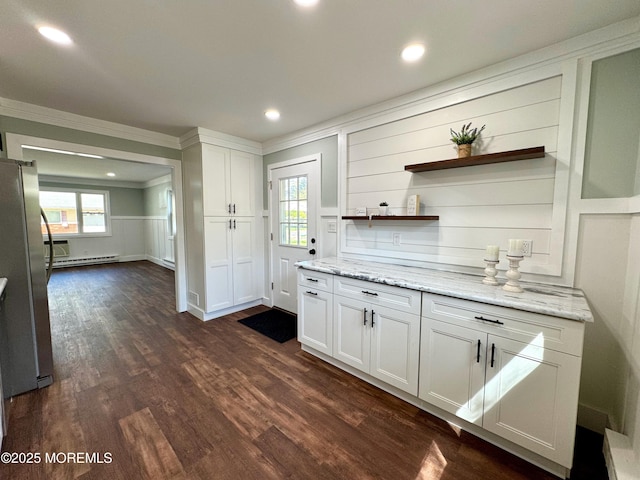 kitchen with open shelves, baseboard heating, freestanding refrigerator, white cabinetry, and ornamental molding