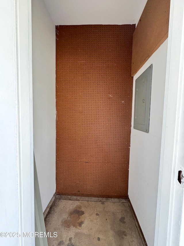 interior space featuring concrete floors and electric panel