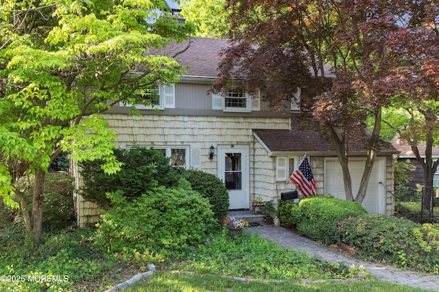 view of front of property with roof with shingles