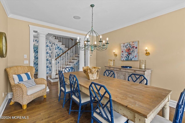 dining area with wood finished floors, baseboards, an inviting chandelier, ornamental molding, and stairs