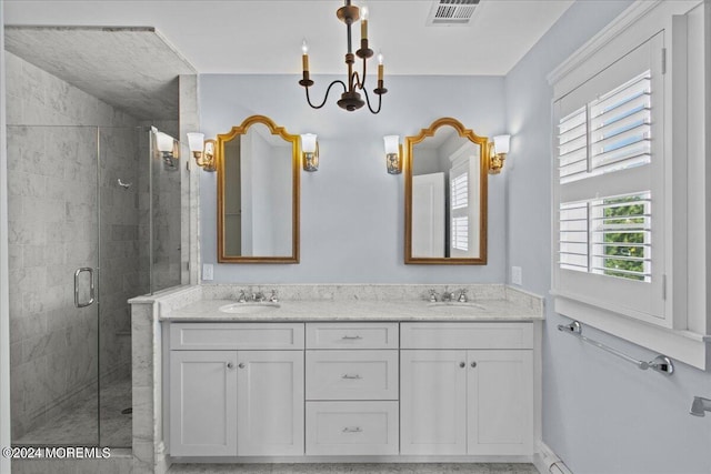 full bath with visible vents, a sink, a stall shower, and double vanity
