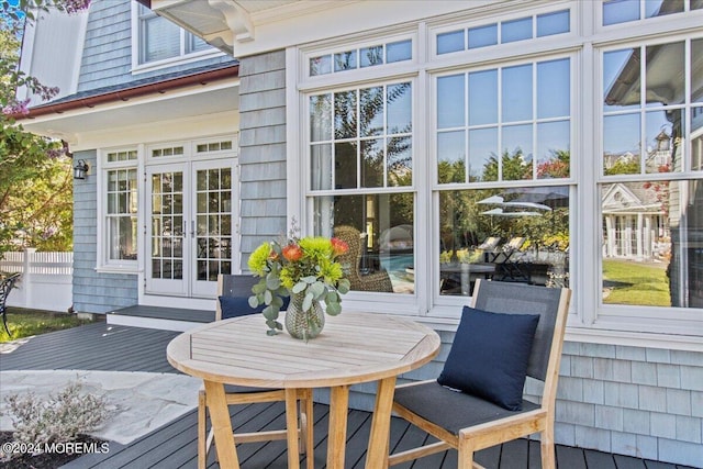 exterior space with outdoor dining area and french doors