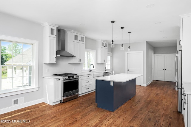 440 Ellisdale Rd, Chesterfield, NJ 08515 - kitchen featuring visible vents, a kitchen island, wall chimney exhaust hood, a sink, and appliances with stainless steel finishes