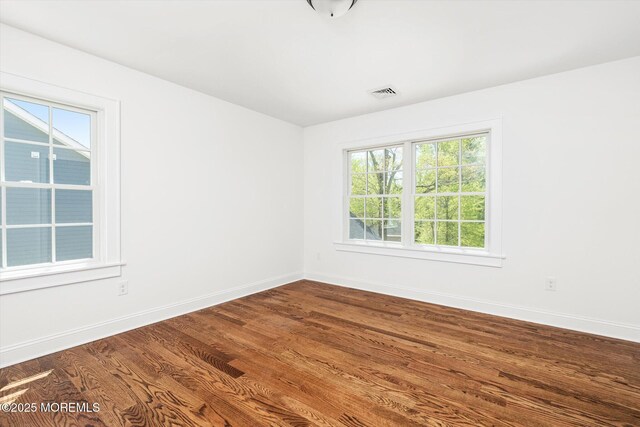 440 Ellisdale Rd, Chesterfield, NJ 08515 - empty room featuring visible vents, dark wood finished floors, and baseboards