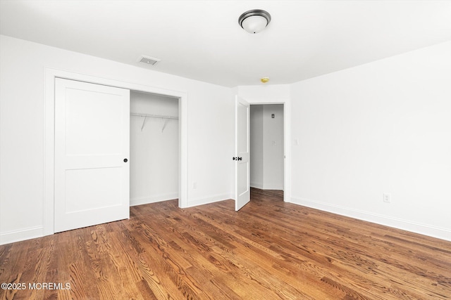 440 Ellisdale Rd, Chesterfield, NJ 08515 - unfurnished bedroom featuring baseboards, a closet, wood finished floors, and visible vents