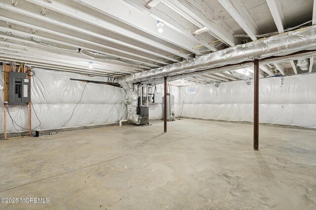 440 Ellisdale Rd, Chesterfield, NJ 08515 - unfinished below grade area featuring heating unit, gas water heater, and electric panel