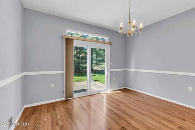 21 Edgeworth Cir, Manchester, NJ 08759 - unfurnished room with baseboards, a chandelier, and wood finished floors