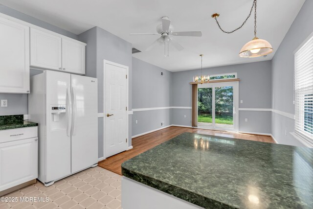 21 Edgeworth Cir, Manchester, NJ 08759 - kitchen with white cabinets, visible vents, white fridge with ice dispenser, and ceiling fan with notable chandelier
