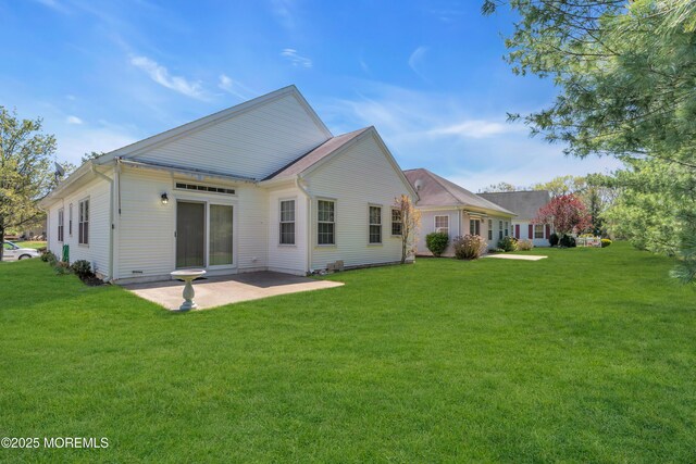 21 Edgeworth Cir, Manchester, NJ 08759 - rear view of house with a yard and a patio