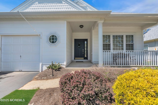 21 Edgeworth Cir, Manchester, NJ 08759 - entrance to property featuring a porch and an attached garage