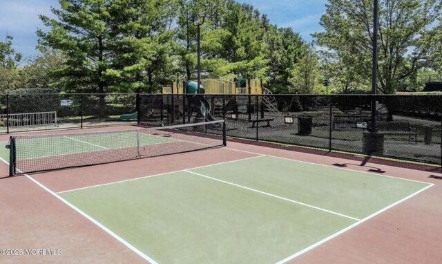21 Edgeworth Cir, Manchester, NJ 08759 - view of sport court with playground community, community basketball court, and fence