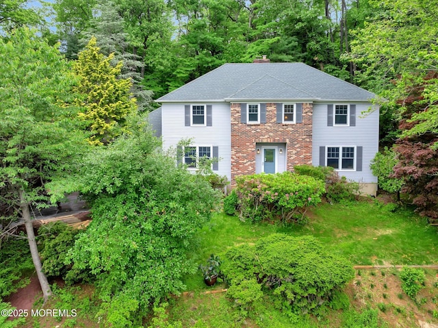 9 Berkshire Ct, Holmdel, NJ 07733 - view of front of home with a chimney, a shingled roof, and brick siding