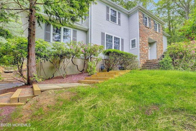 9 Berkshire Ct, Holmdel, NJ 07733 - view of front facade featuring brick siding