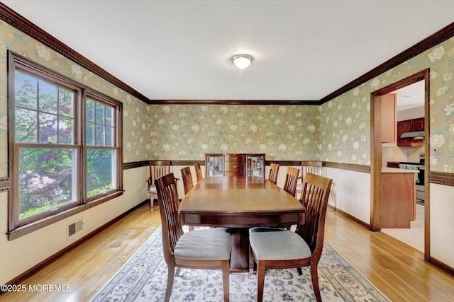 9 Berkshire Ct, Holmdel, NJ 07733 - dining space featuring light wood-type flooring, wallpapered walls, plenty of natural light, ornamental molding, and baseboards