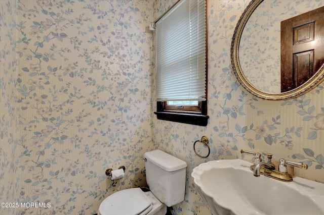 9 Berkshire Ct, Holmdel, NJ 07733 - half bathroom featuring wallpapered walls, a sink, and toilet