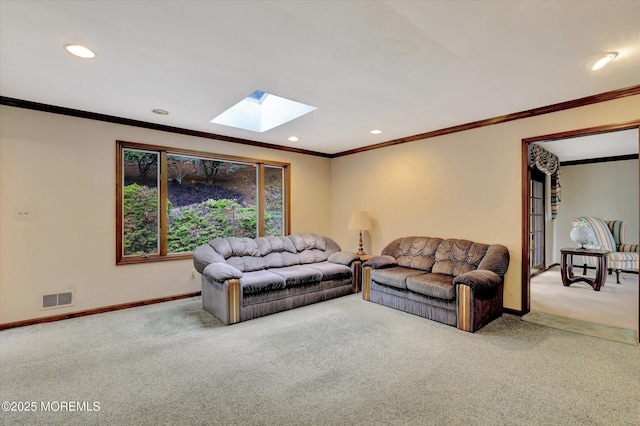 9 Berkshire Ct, Holmdel, NJ 07733 - living area with carpet floors, a skylight, ornamental molding, baseboards, and recessed lighting