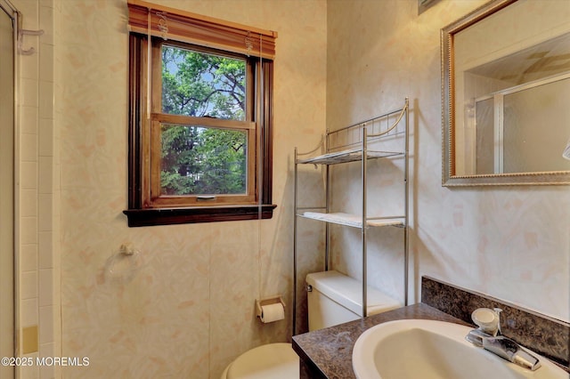 9 Berkshire Ct, Holmdel, NJ 07733 - full bathroom featuring wallpapered walls, a stall shower, toilet, and vanity