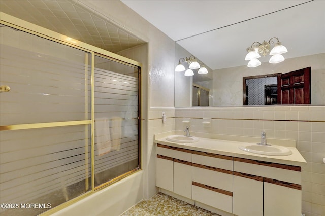 9 Berkshire Ct, Holmdel, NJ 07733 - bathroom featuring bath / shower combo with glass door, double vanity, backsplash, and a chandelier