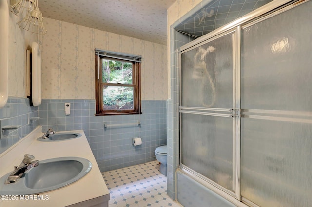 9 Berkshire Ct, Holmdel, NJ 07733 - full bathroom featuring tile walls, wainscoting, wallpapered walls, double vanity, and toilet