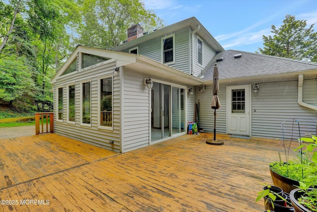9 Berkshire Ct, Holmdel, NJ 07733 - back of house featuring a chimney, a wooden deck, and a shingled roof