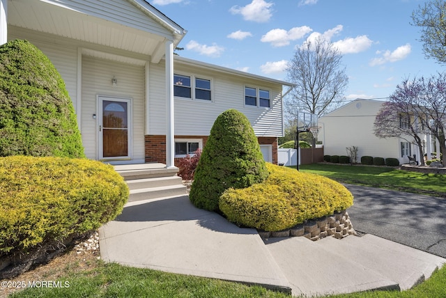 property entrance with brick siding