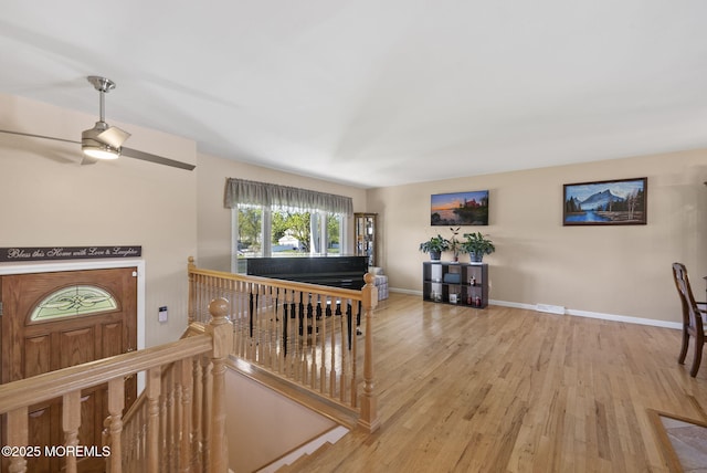 interior space with baseboards and wood finished floors