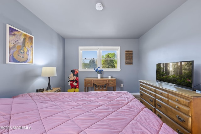 bedroom featuring baseboards