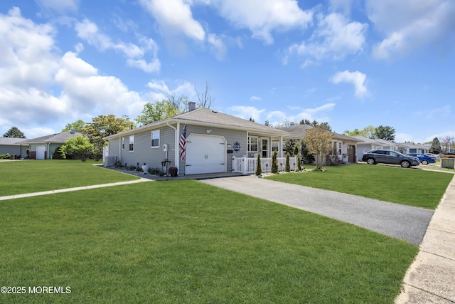 ranch-style house with a garage and driveway
