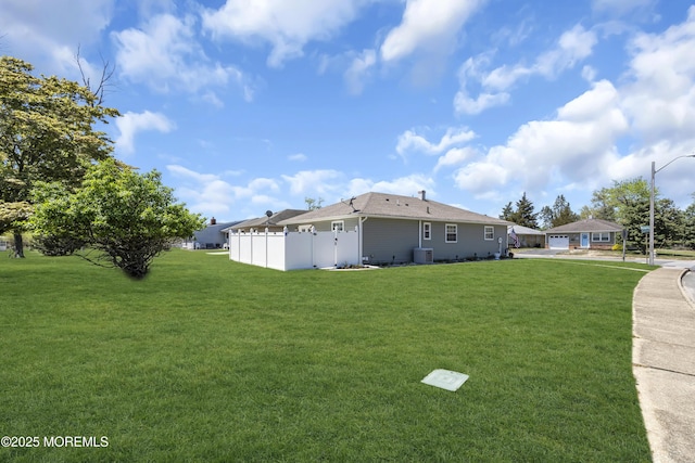 view of side of property featuring cooling unit and a garage