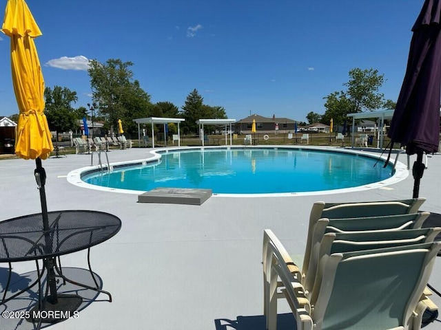 community pool with a patio