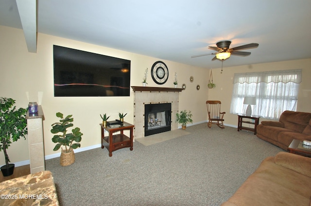 711 Edmunds Ave, Union Beach, NJ 07735 - carpeted living room featuring ceiling fan, a fireplace with flush hearth, and baseboards