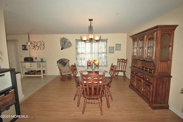 711 Edmunds Ave, Union Beach, NJ 07735 - dining space featuring baseboards, an inviting chandelier, and light wood-type flooring